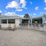 beachside colony pool and bar at the deck